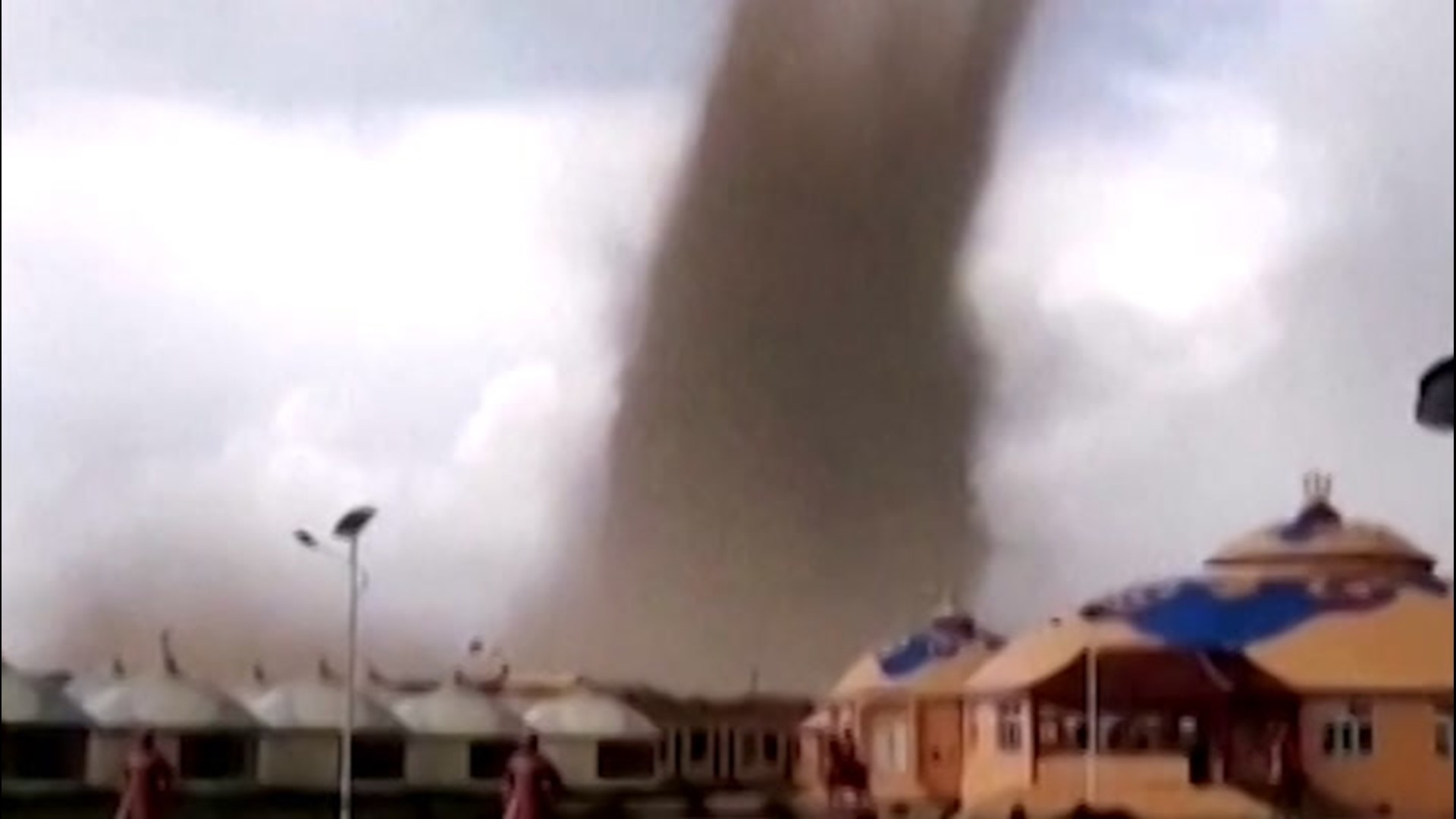 A tornado swept through the city of Baotou, China, on Aug. 9, injuring 33 people. This video captures the moment homes got caught inside the tornado.
