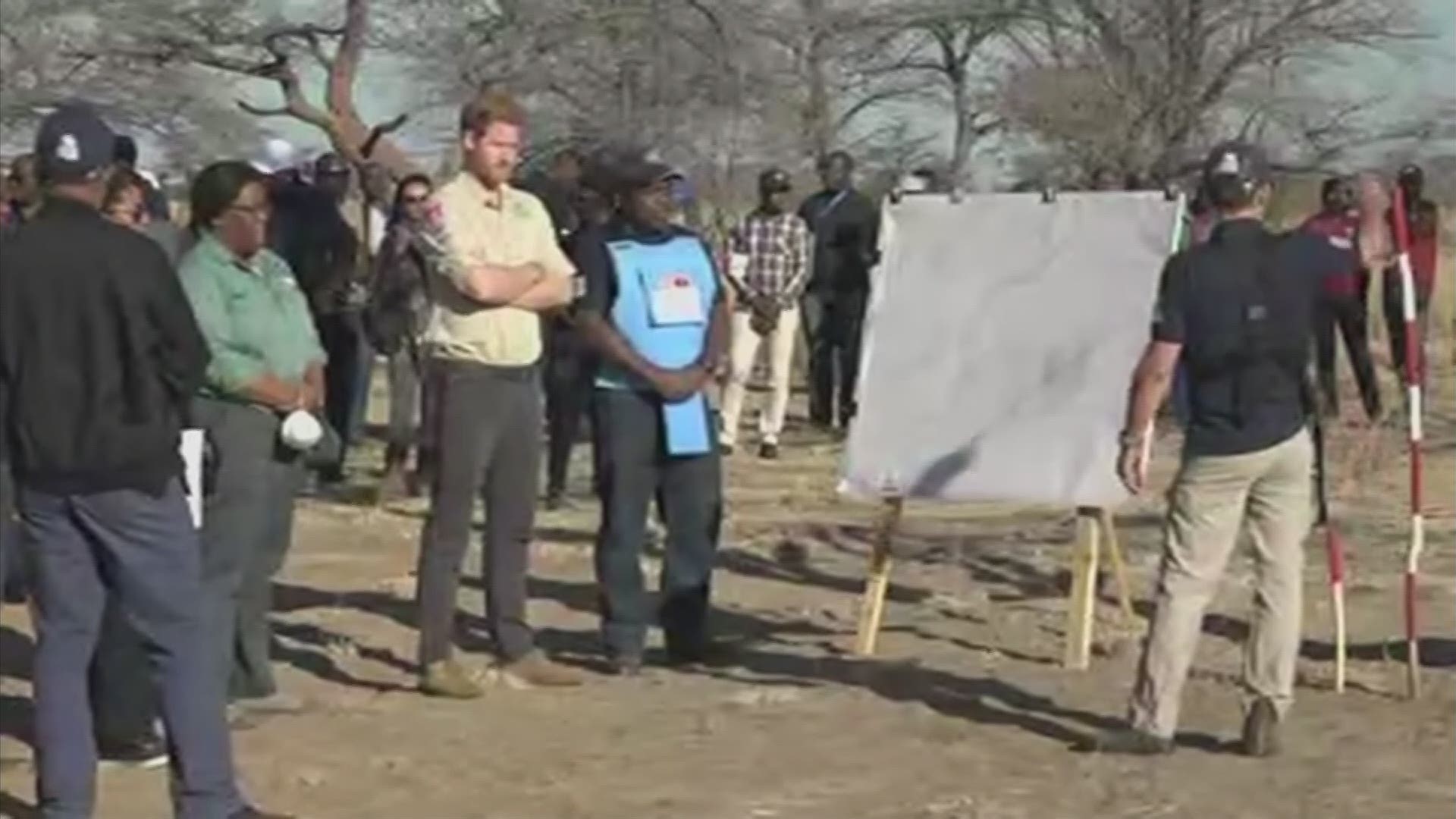 A body armor-wearing Prince Harry on Friday followed in the footsteps of his late mother, Princess Diana, to an active mine field in Angola. (AP)