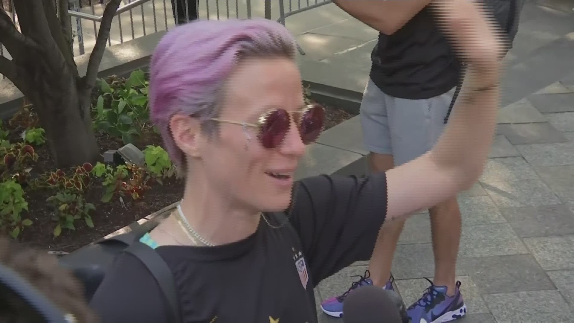 US Soccer star Megan Rapinoe spoke to reporters as the team arrived back in America after winning the Women's World Cup. (AP)