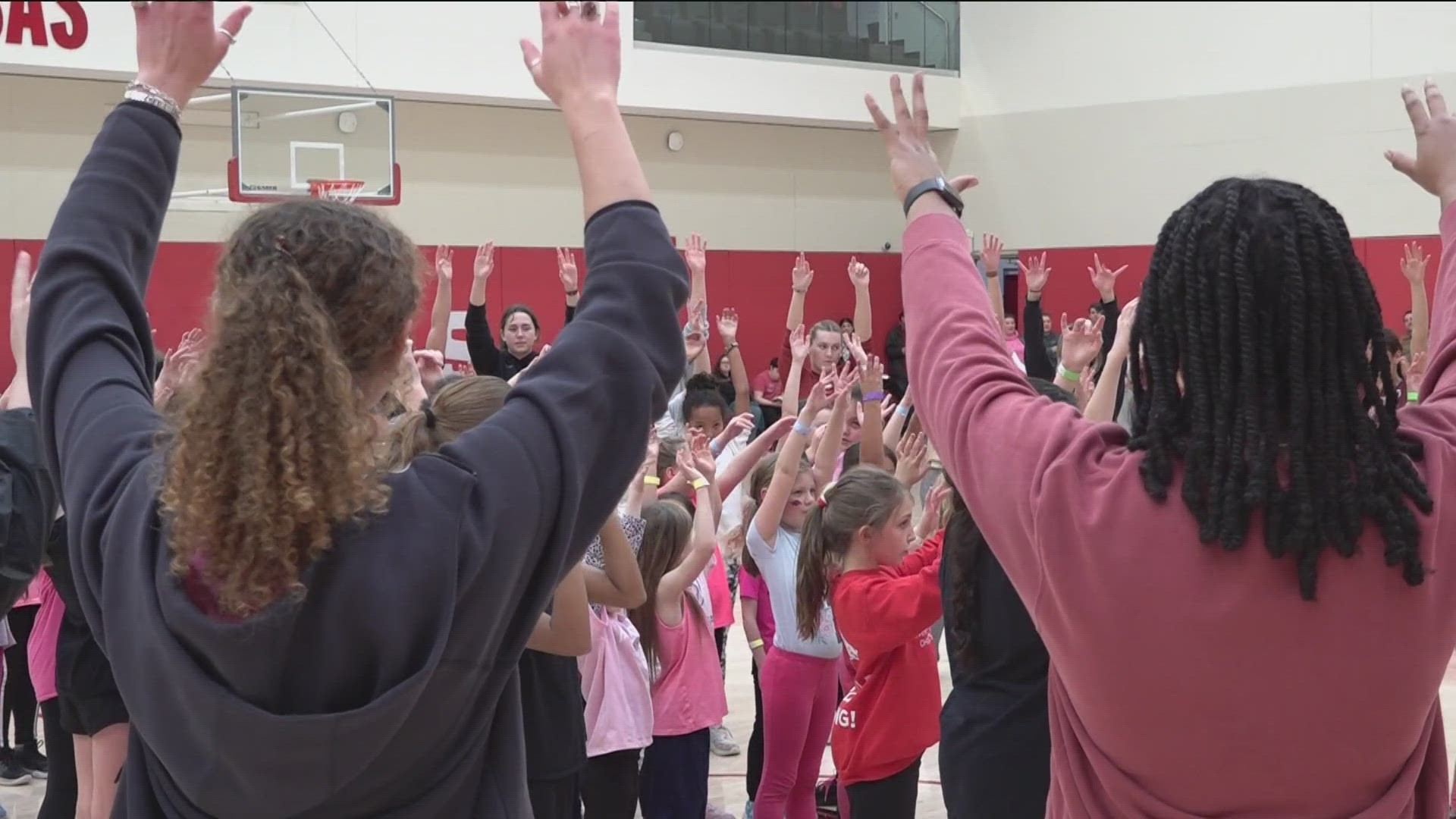 Razorback women athletes came together to host a clinic for young girls, ages 5 through 12, in honor of National Girls and Women in Sports Day.