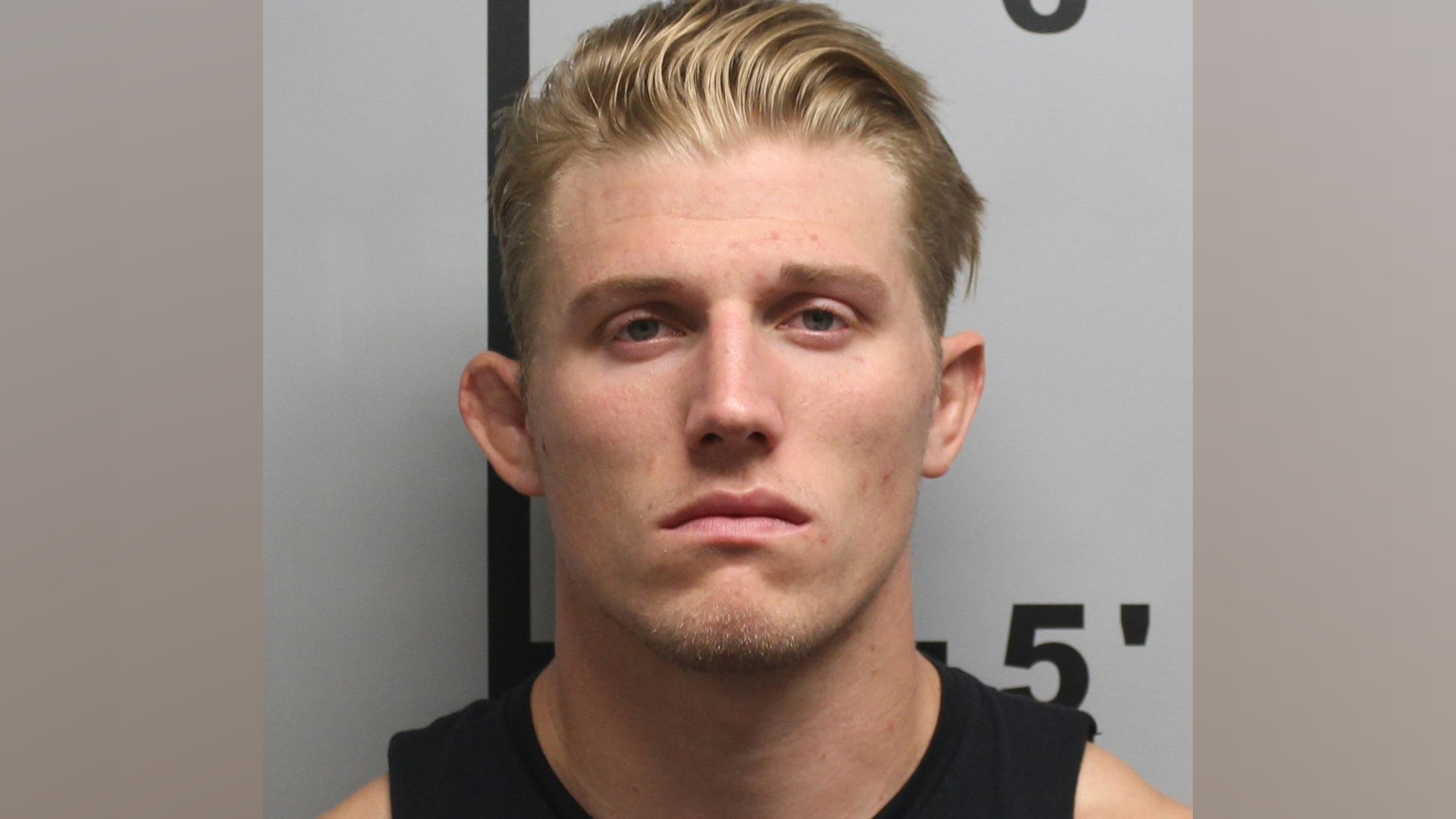 Former Rogers High School wrestling coach Colton Looper was arrested on one charge of sexual assault.