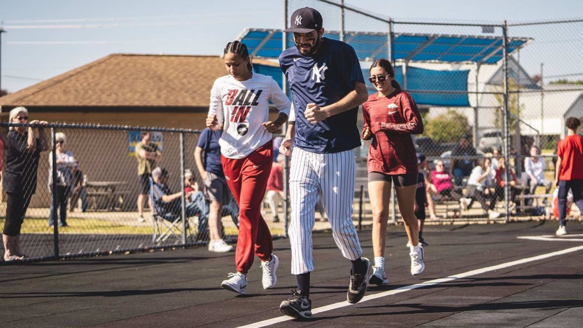 When some Arkansas softball players went to one of Kole Smith's Miracle League baseball games, it started a companionship that goes beyond the field.