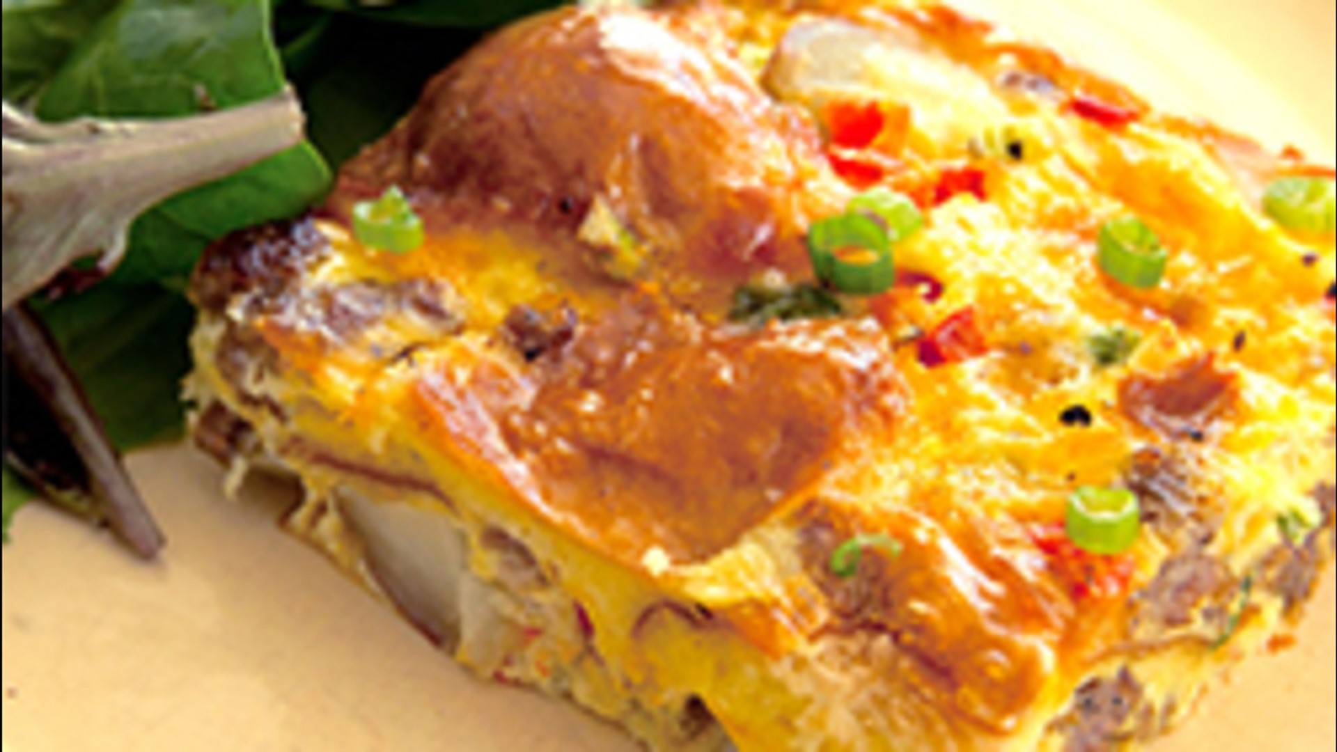 Behold, the breakfast casserole that really does have it all.  It's easy to whip together, feeds a ton of people, and has all your major food groups represented: eggs, potatoes, sausage, veggies and bread. So, there's no need for any additional sides nor 