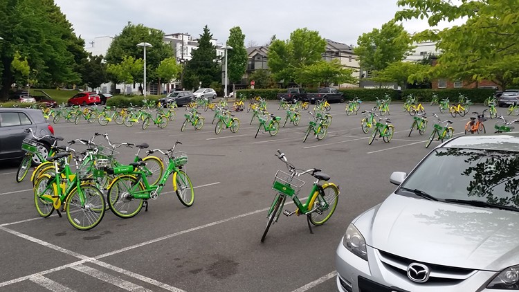 Dozens of LimeBikes left in Seattle school parking lot as senior prank