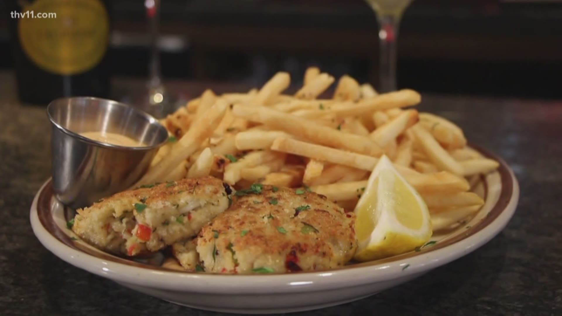 Atlas Bar in Soma has more than just your typical bar food. They have a unique collection of international dishes -- including crab cakes served with sriracha aioli.