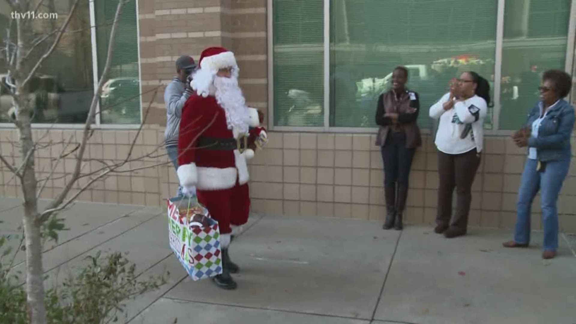 Children in state foster care got an extra special visit from Santa, firefighters, and their friends at the Arkansas Department of Human Services.