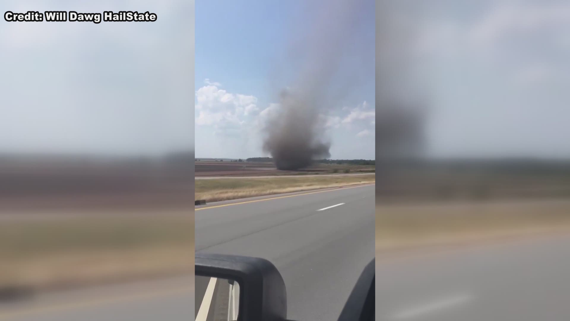 It's a twister, it's a twister! Not really.. But it is a giant dust devil crossing a burning field near south of Pine Bluff yesterday! WOW!