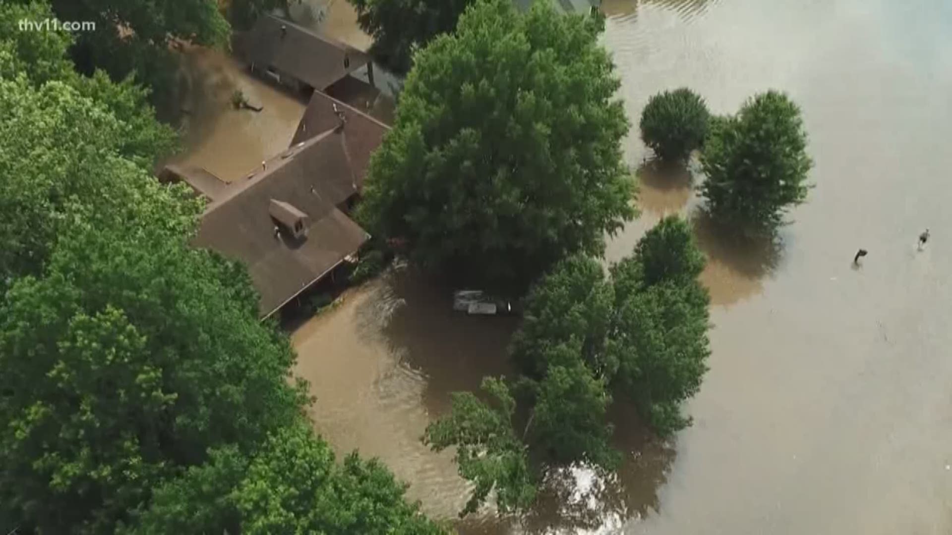 Houses in North Little Rock are underwater tonight as the banks of the Arkansas River spill over into neighborhoods.