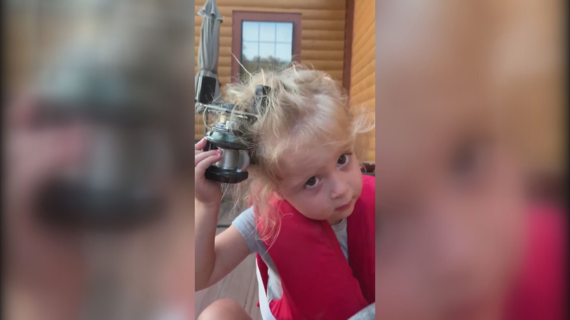 During a fishing trip with her dad, a girl got a fishing reel caught in her hair