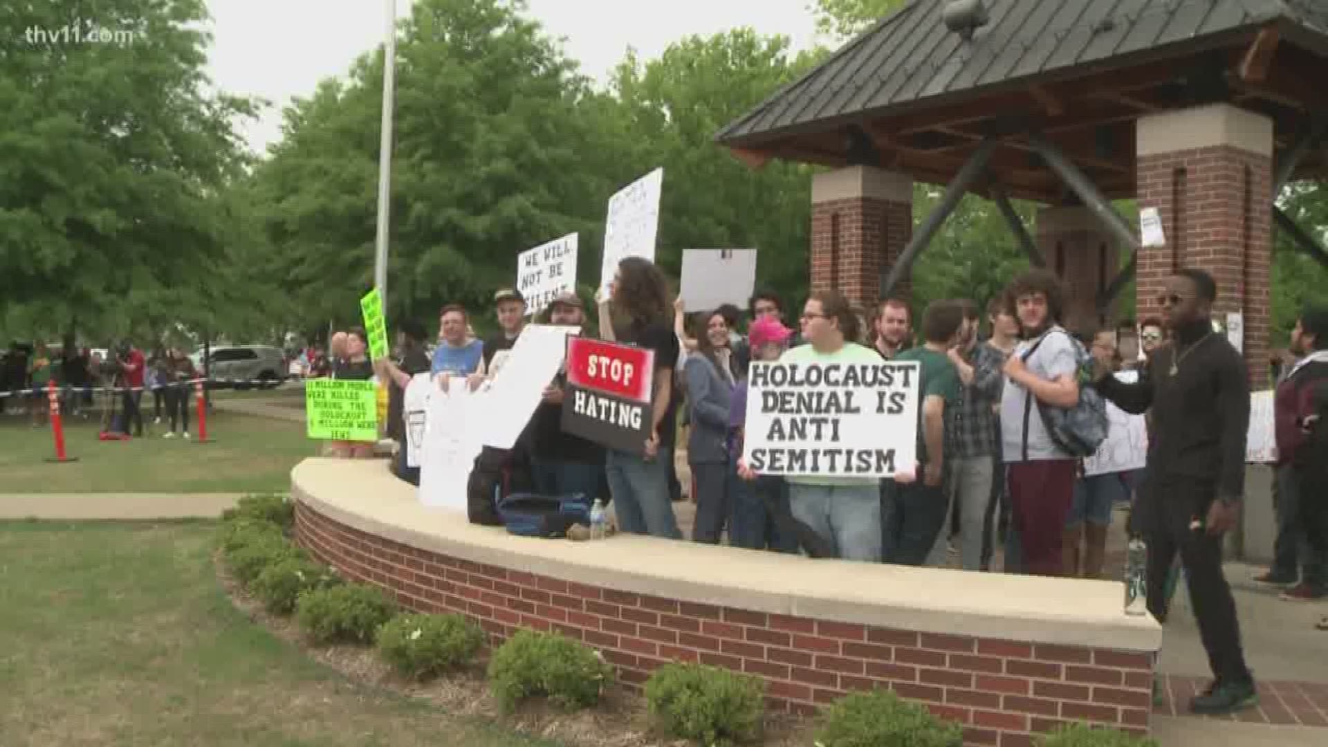 A protest against a controversial scholarship drew a large crowd of students and at least one member of a local white nationalist group.