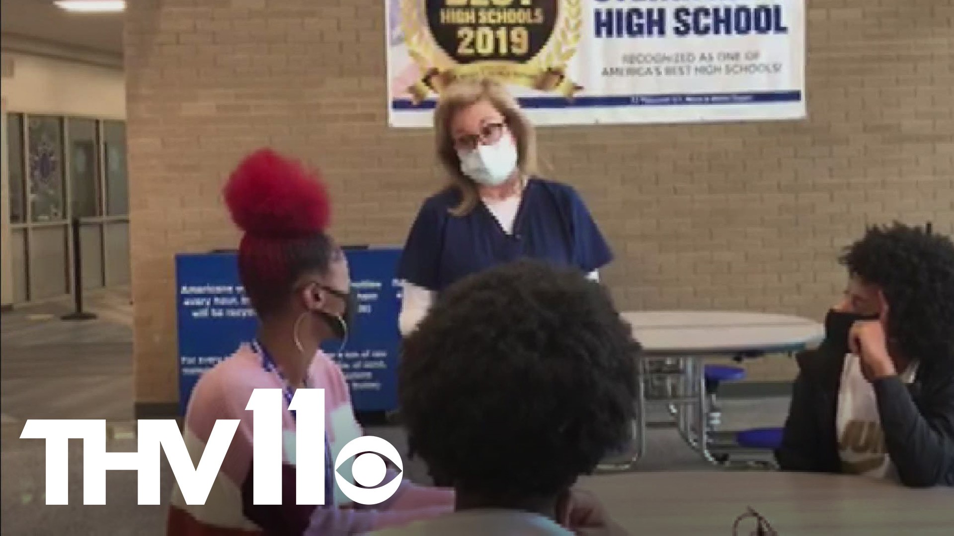 A Sylvan Hills High School teacher is the first in the school to get the COVID-19 vaccine and now she's educating her students about vaccines and how they work.