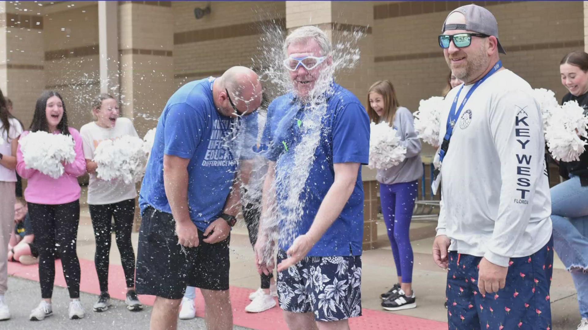 After students collected enough cereal boxes, Chief meteorologist Tom Brannon put his reflexes to the test as students from Bethel Elementary water ballooned him.