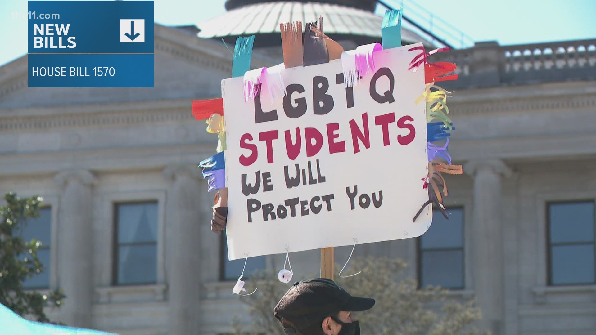 Several people gathered at the Arkansas State Capitol at a transgender rights rally to protest two proposed bills.