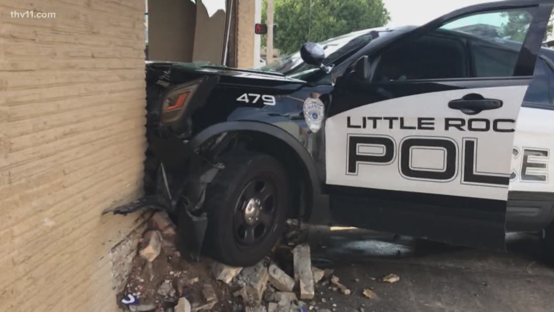 A police vehicle crashed into a building in downtown Little Rock.