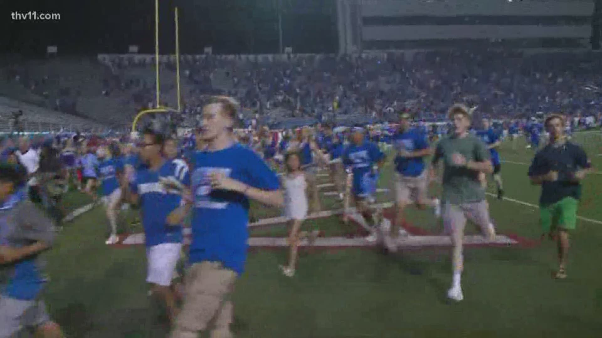 At the biggest high school football game in Arkansas , a fight and loud bangs send a scare across War Memorial Stadium