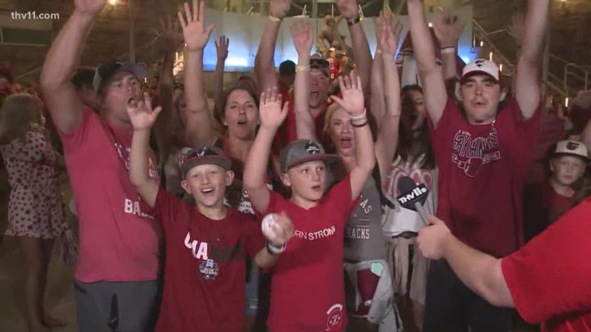 Hogs fans celebrate victory with Hayden Balgavy in Omaha