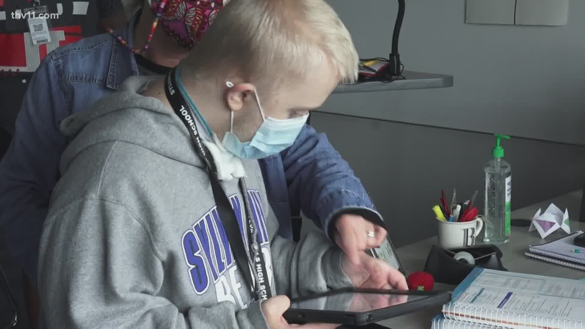 Campbell has an app that says his words for him. He’s using it to communicate on the job as he delivers PPE to classes at his school.