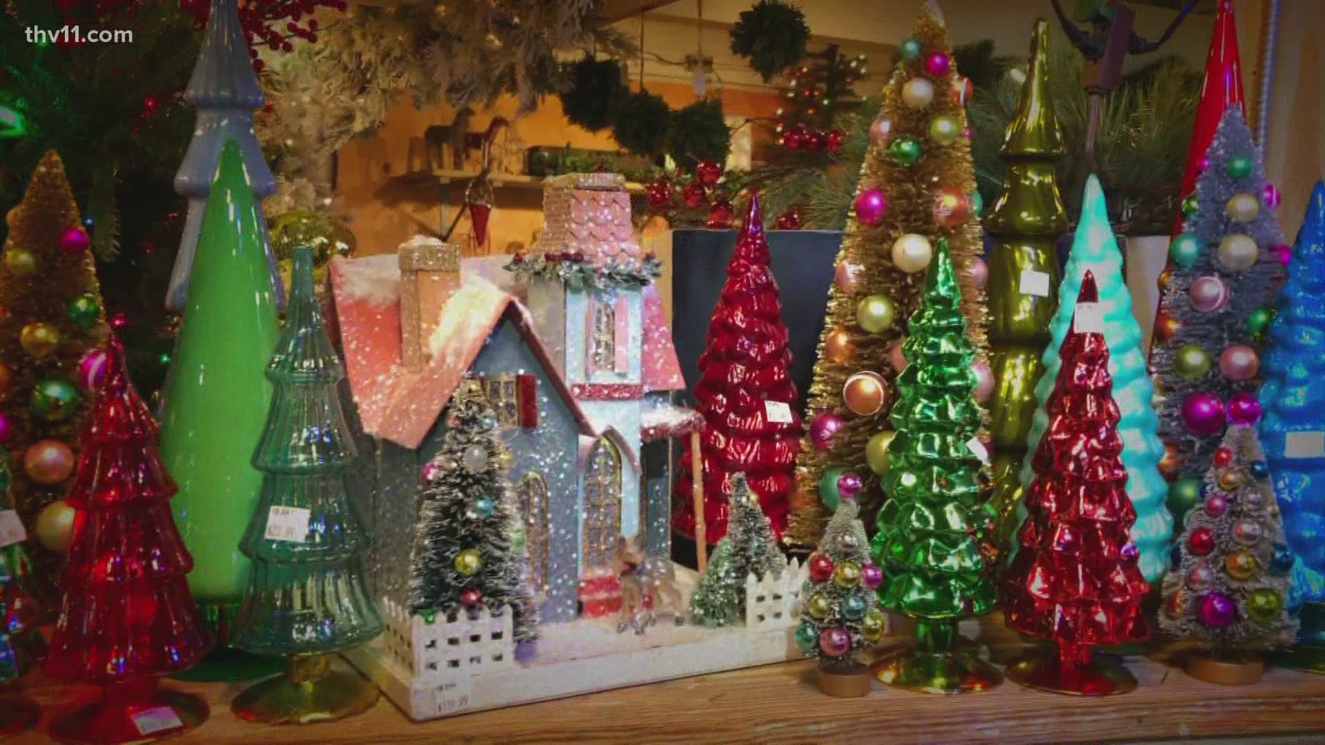 Chris Olsen shares ideas for decorating the mantel for Christmas, such as glittery Christmas houses and trees and painted logs beside the fireplace.