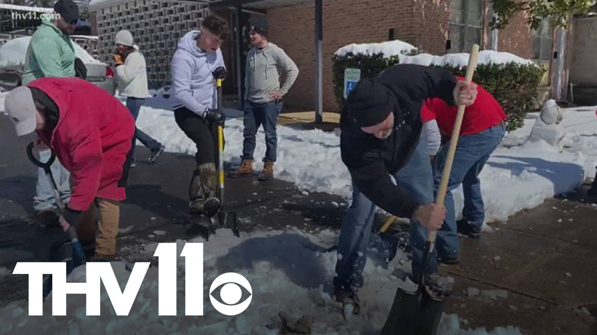 Volunteers from different groups and organizations began the clean up efforts for World Services for the Blind after pipes busted from freezing temperatures.