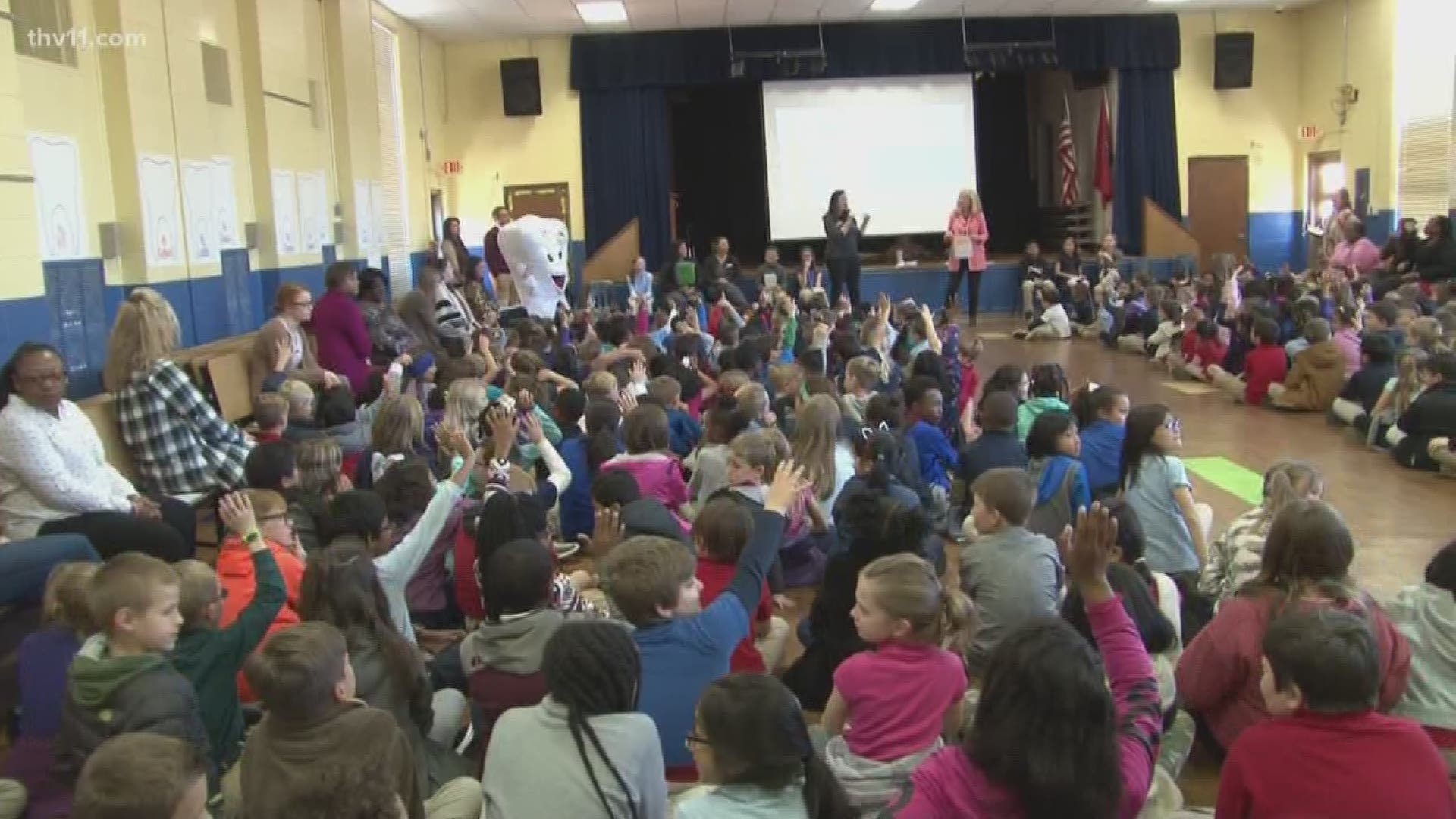 Craig reads to Baker Elementary