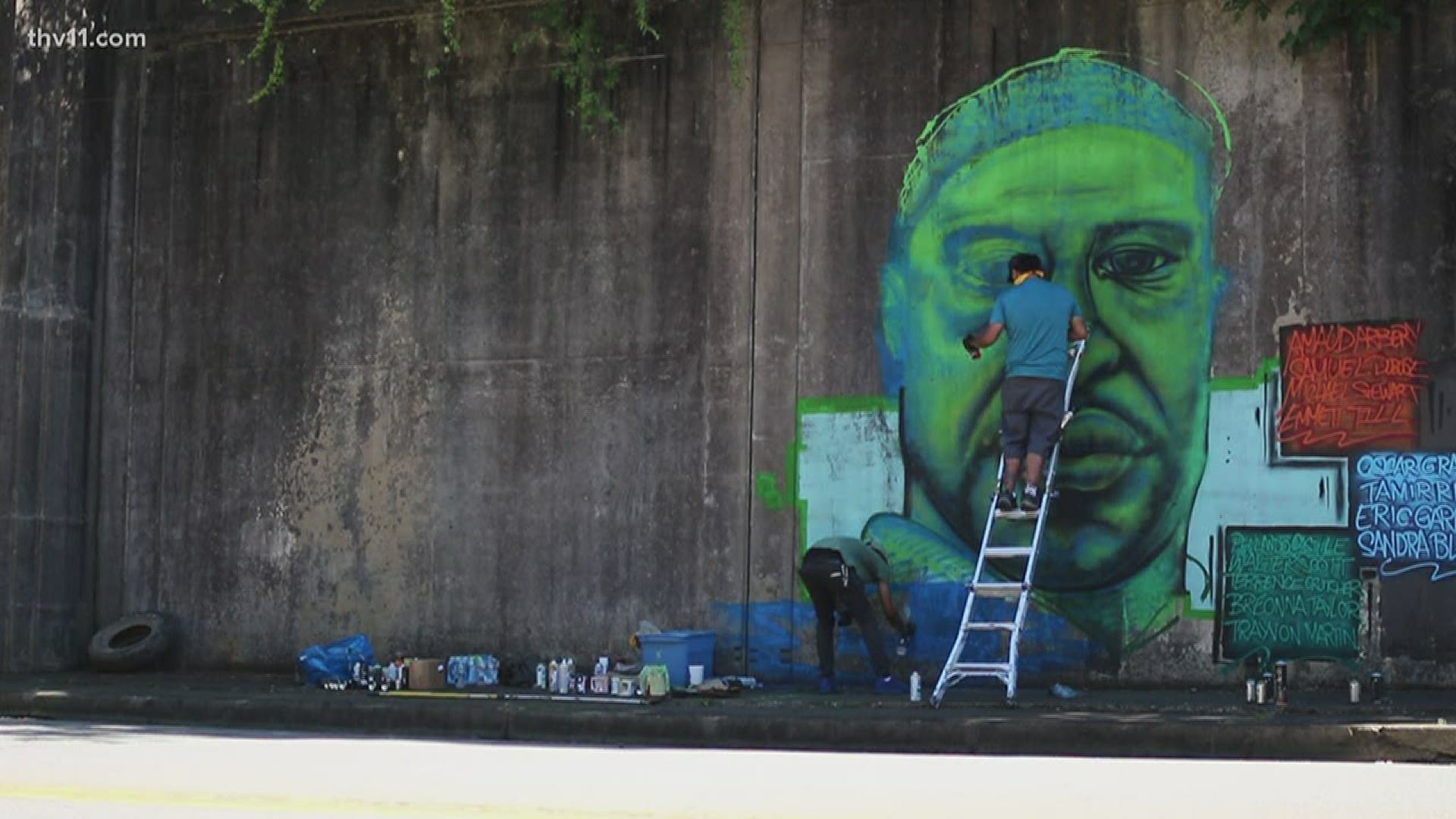 Two artists created a mural in dedications to George Floyd and other African Americans who lost their lives to police brutality. They hope to raise awareness.