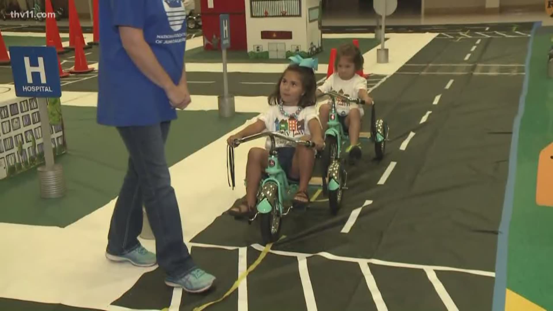 The citizens of Safety Town learn the rules of the road at a young age.