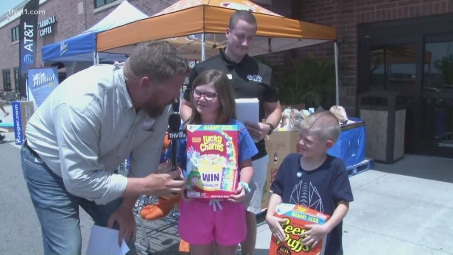 Adam Bledsoe live in Benton as residents drop off cereal for the Cereal Drive at Kroger.