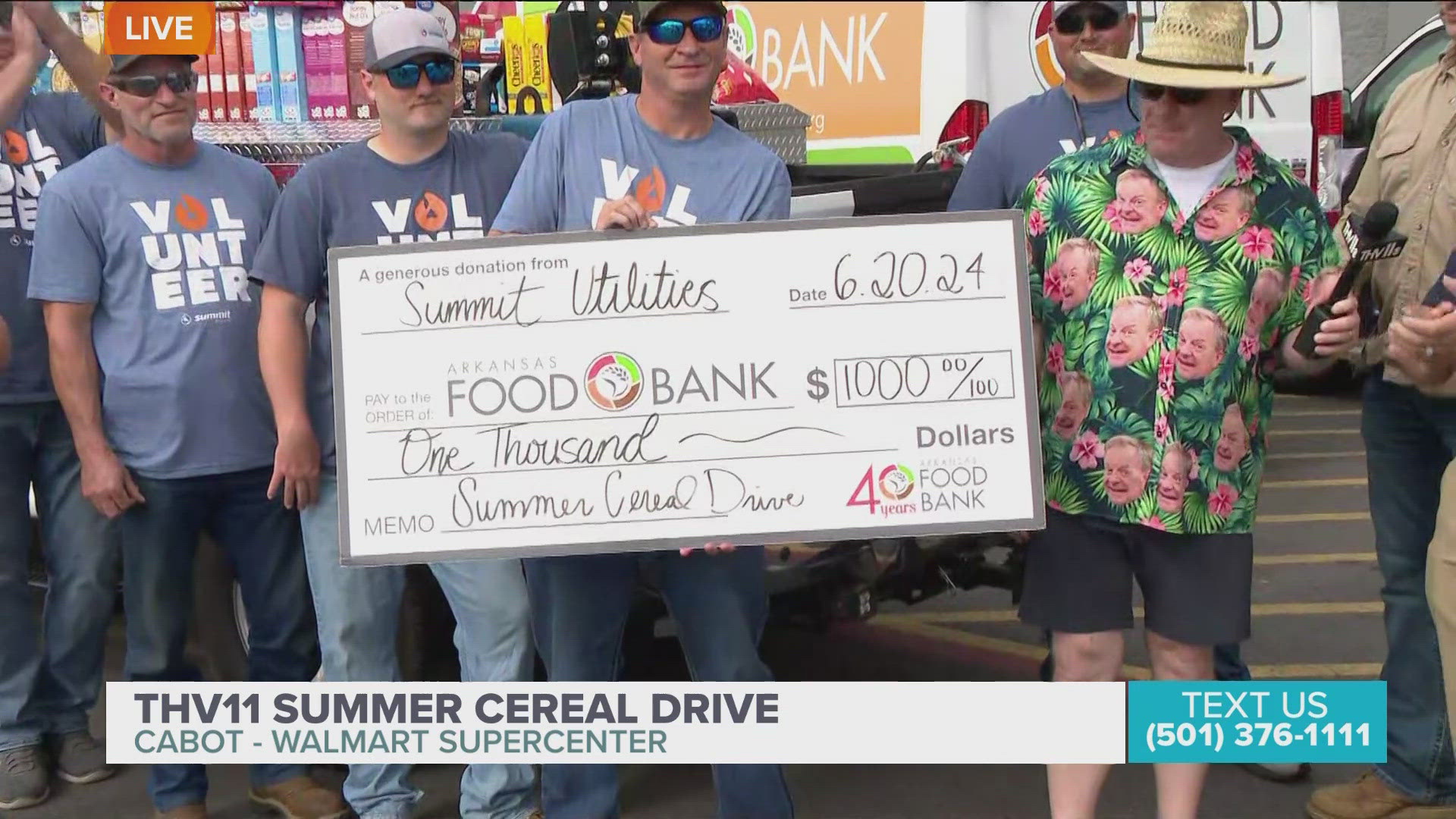 Summit Utilities donates cereal boxes and check for $1000 to THV11 Summer Cereal Drive.