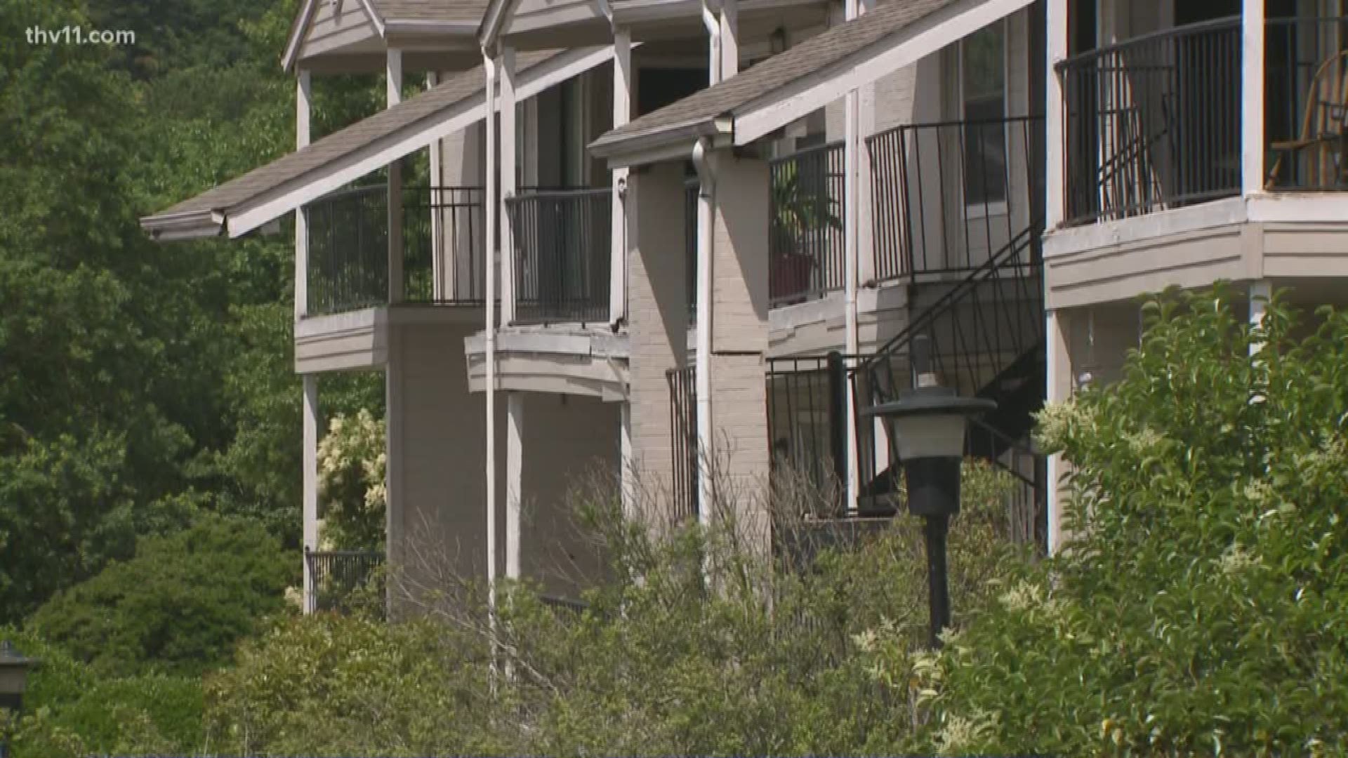 A staircase and balcony collapsed into a sinkhole outside building 6 at the Riverwalk Apartments in Little Rock.