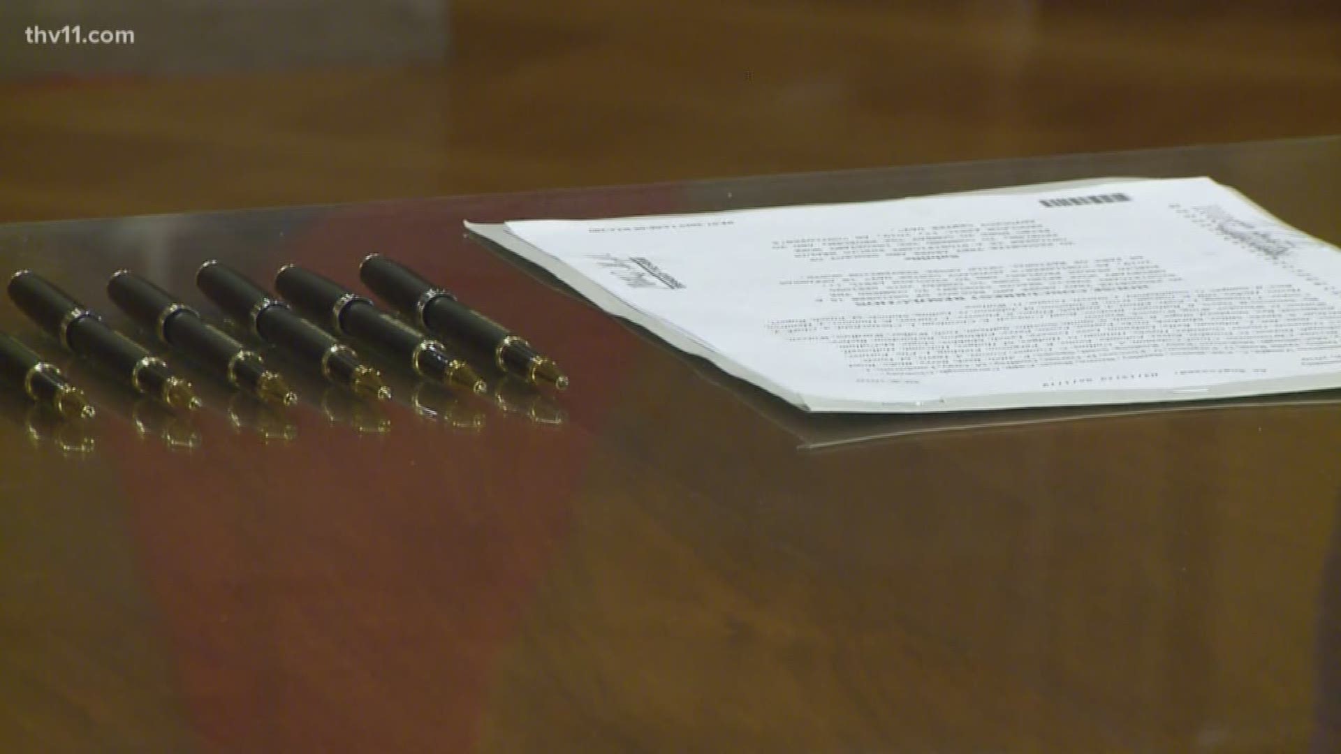 Gov. Asa Hutchinson signs bill recognizing the importance of child abuse prevention.