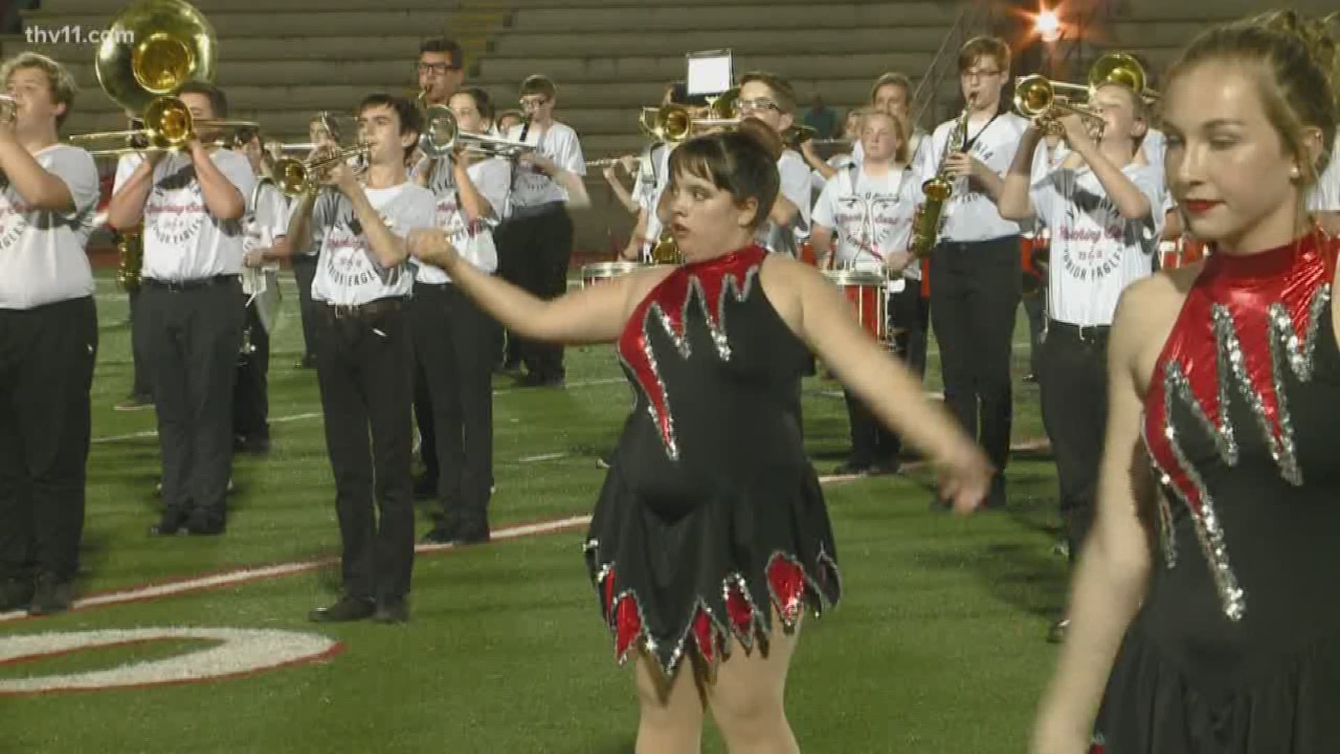 A high schooler with autism is breaking down barriers by proving she can do anything, including twirl for her middle school band.
