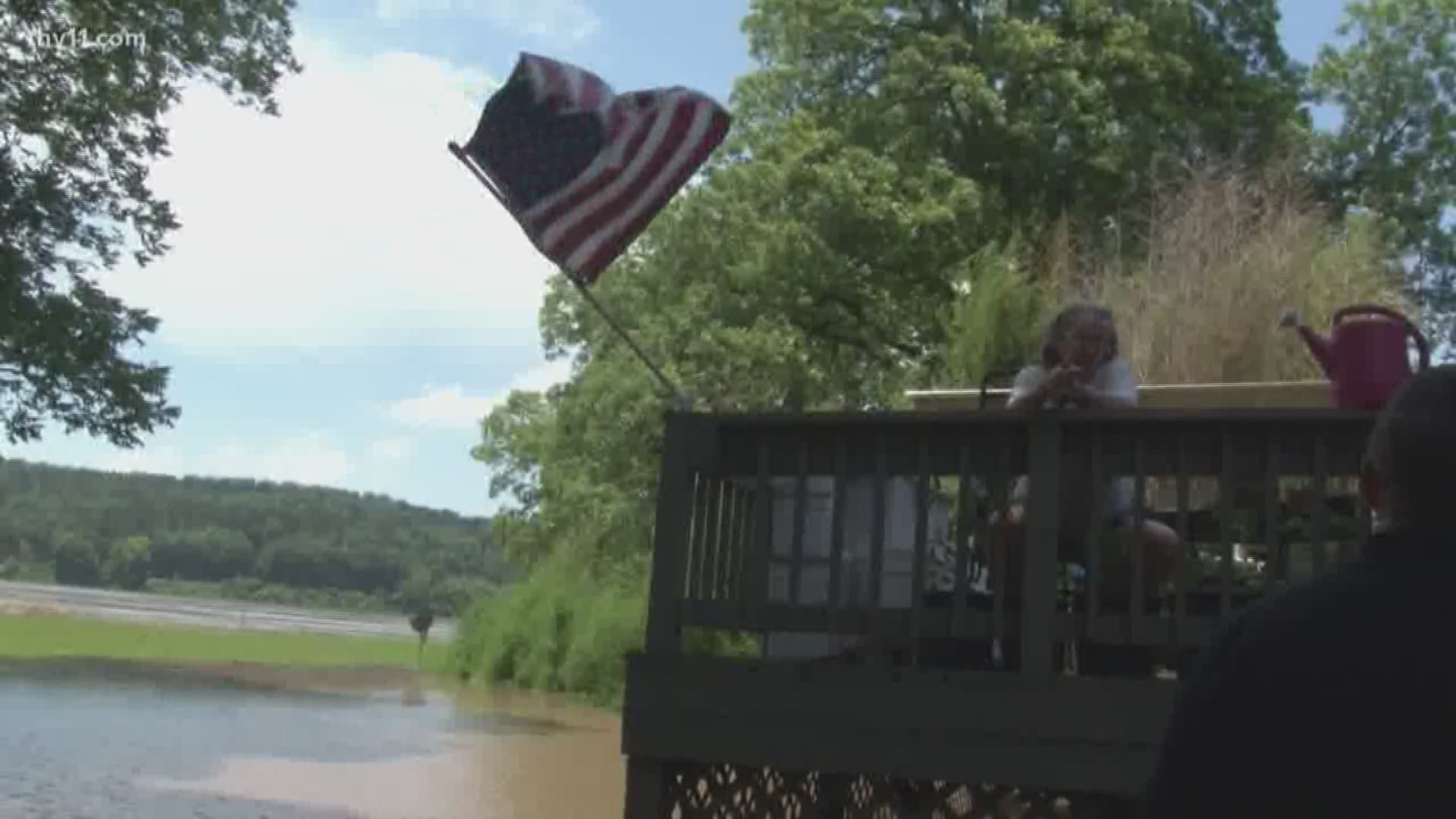 Faulkner County officials have set up checkpoints along the raging Arkansas River, closing off strips of land that are quickly going under water as a historic flood