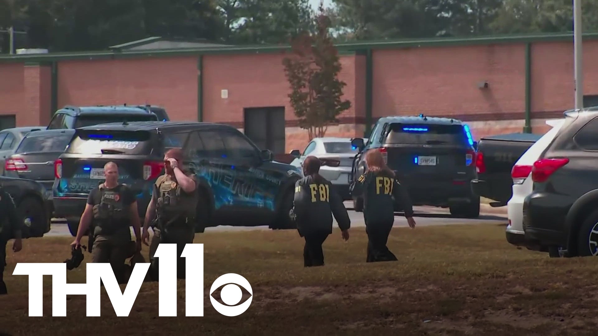 Police continue to sort through the scene of a deadly shooting at a high school in Georgia.