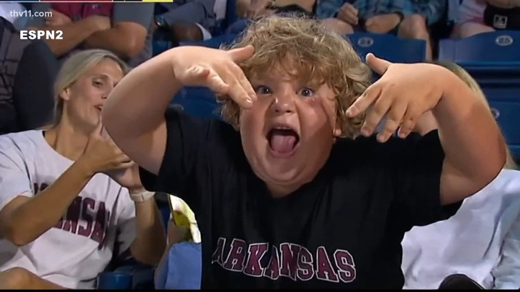 Cameras catch young Arkansas Razorback softball fan nodding off, goes viral