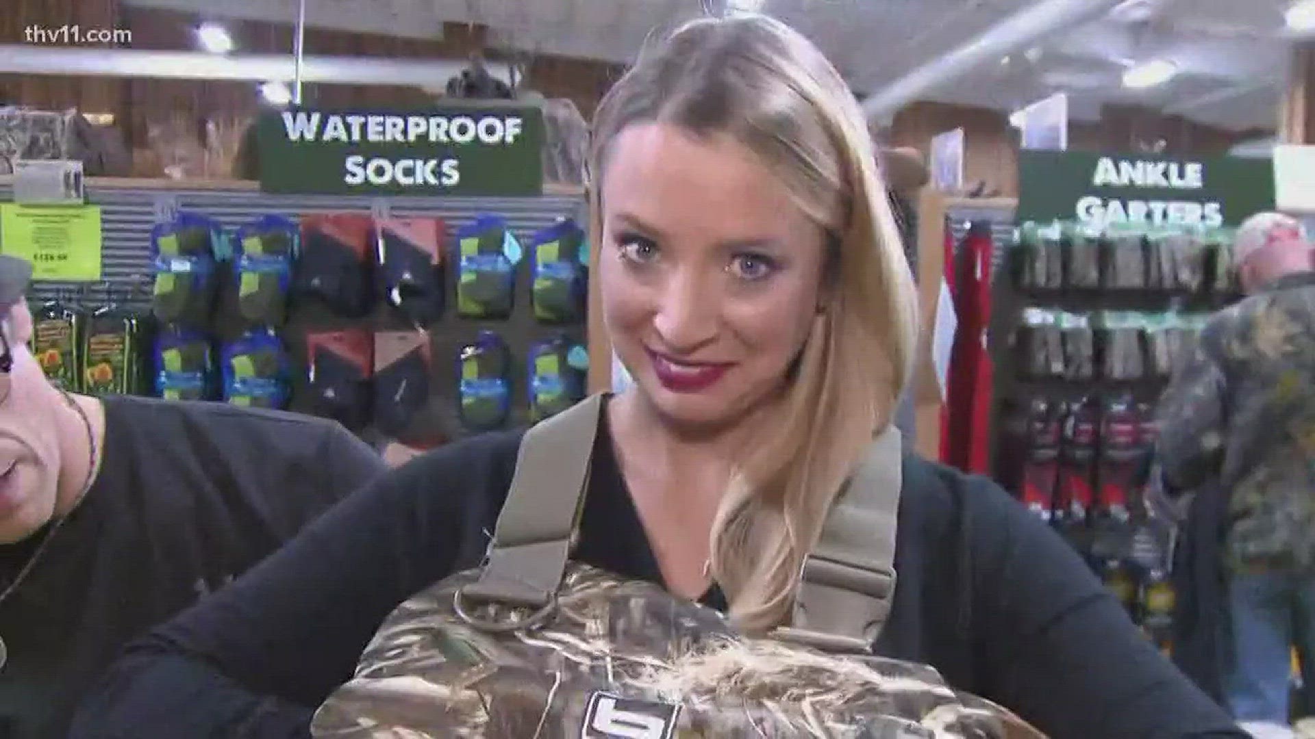 Winnie Wright tried on some duck hunting gear while talking to local hunters.