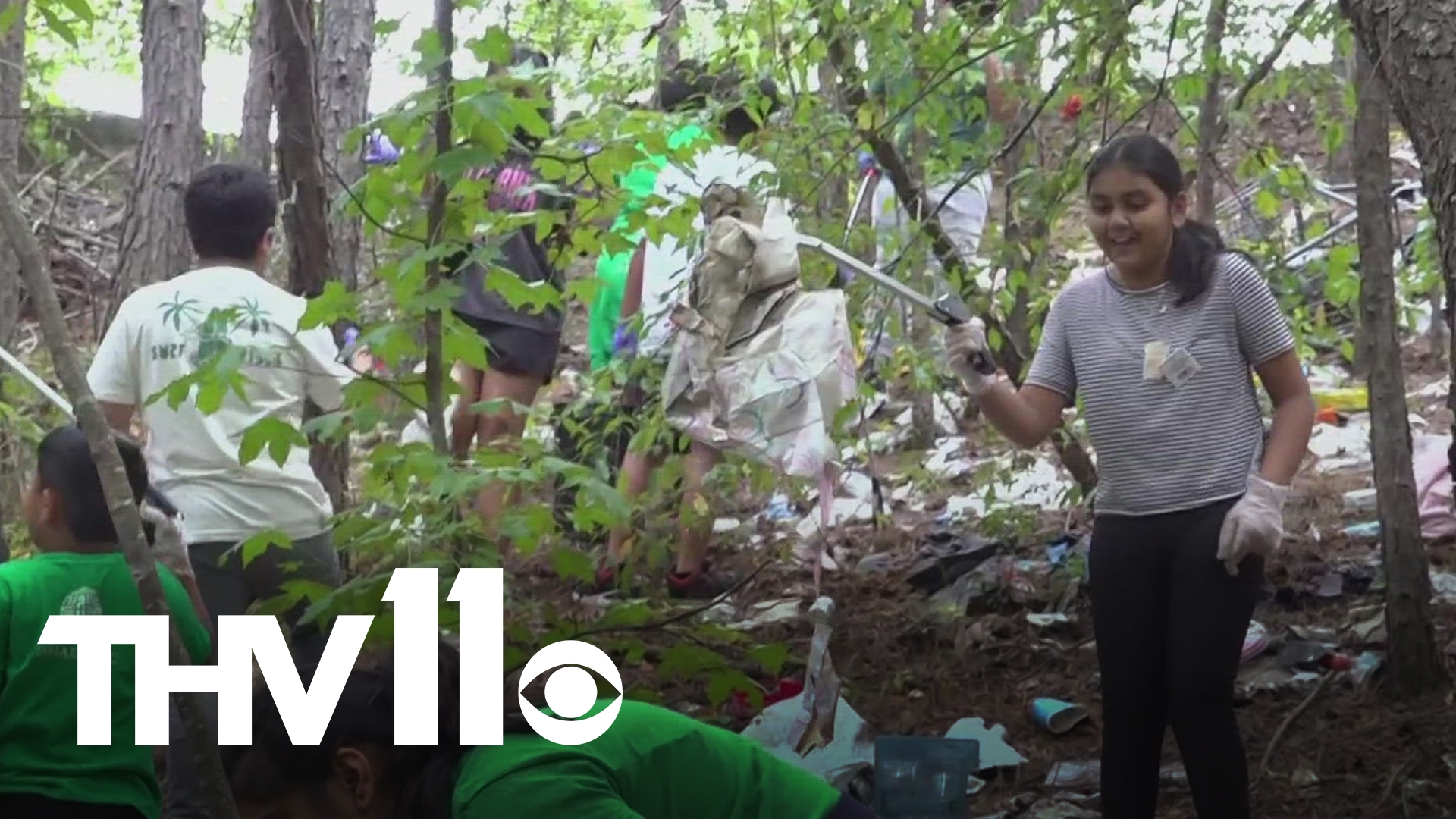 Volunteers in attendance cheered the trail's reopening, then picked up tools and trash bags to make it look even better.