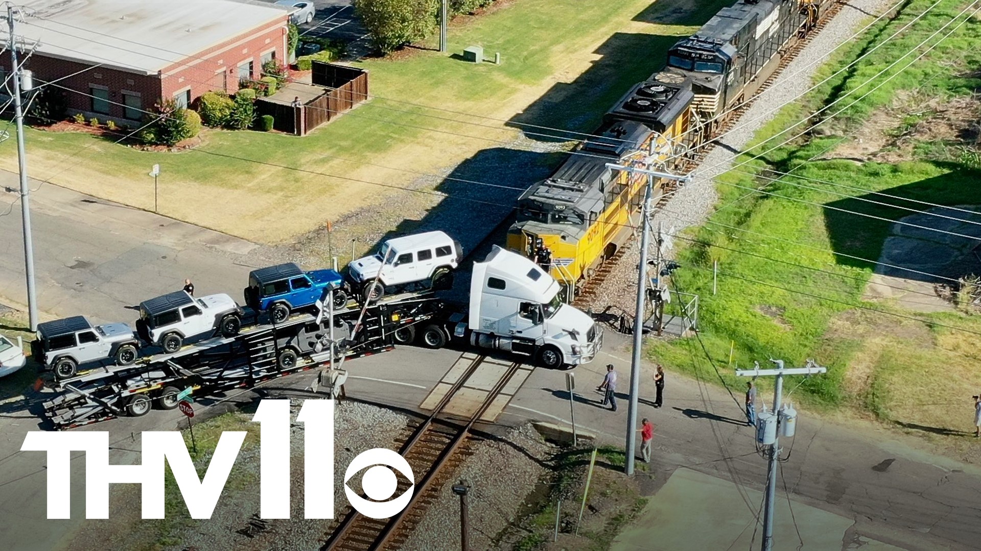 A semi-truck is seen in a photo, stuck on the railroad crossing at Mill Street in Conway.