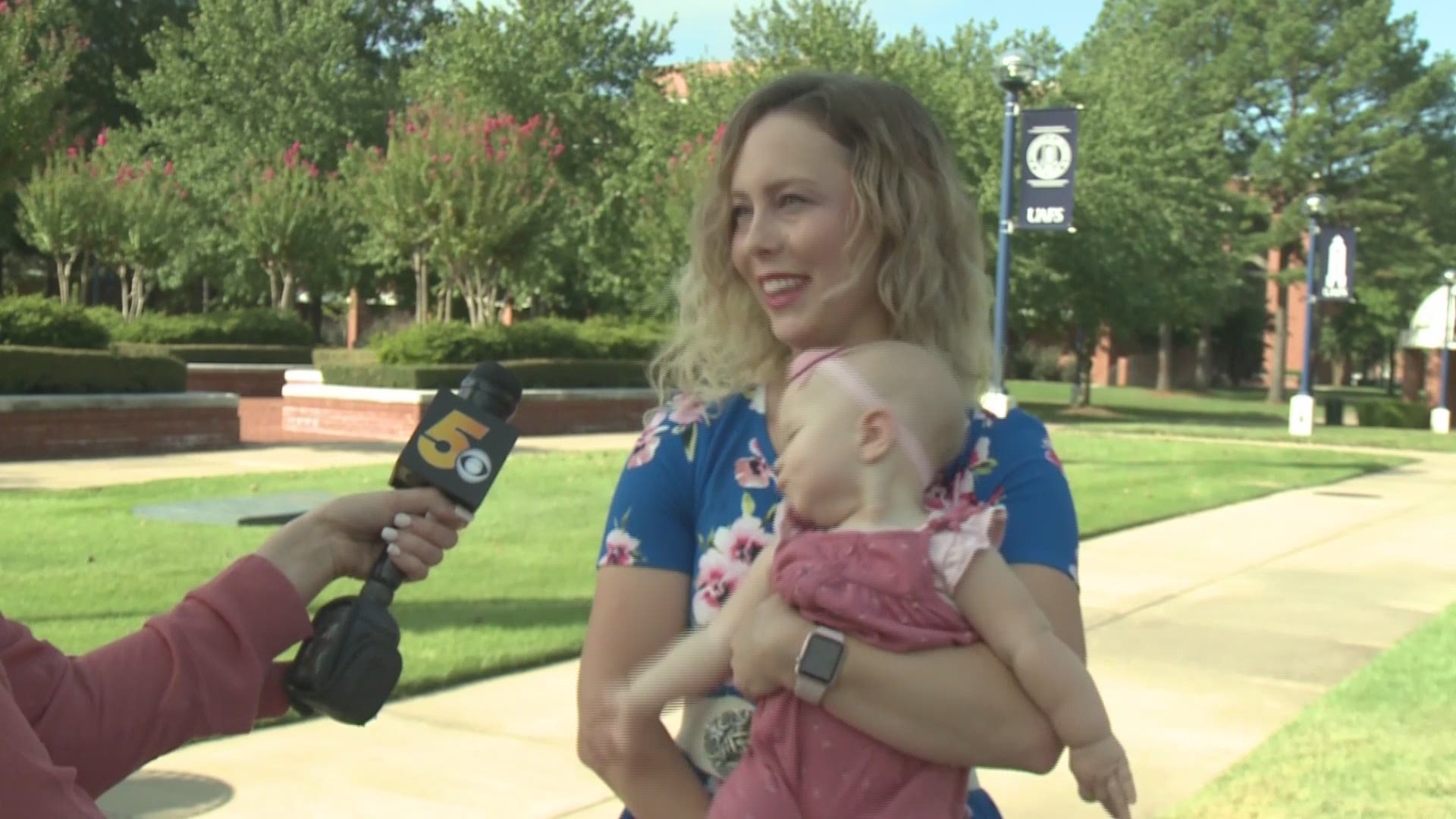 One local professor is getting a lot of attention after photos of her holding a student's baby while lecturing went viral online, reaching over one million people on