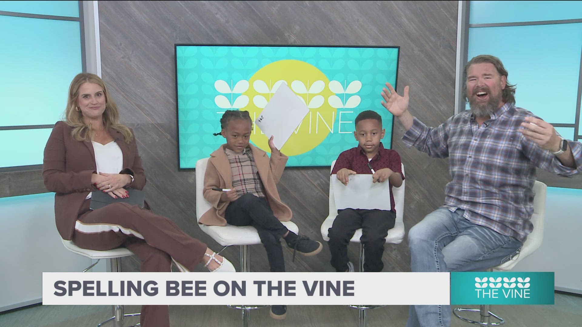 Ashley and Adam are testing two local students on their spelling skills. Chance and Kashad are both involved with AR Kids Read.