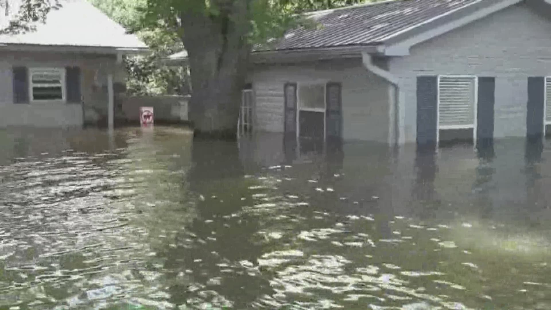 A Riverfront Drive community in Pine Bluff begins the cleanup process following historic flooding of the Arkansas River.