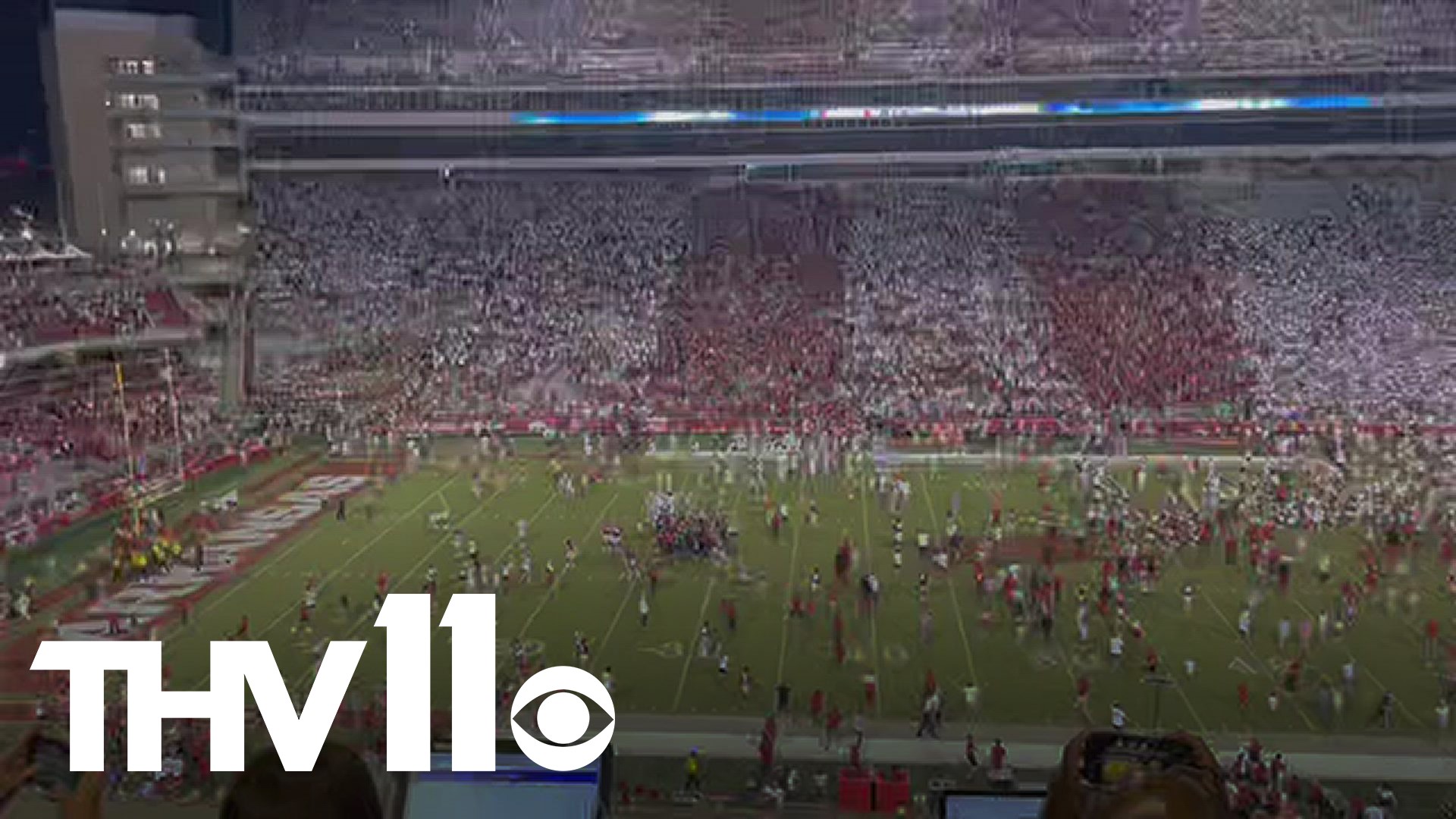 Razorback fans storm the field after Hogs' historic win over Texas!