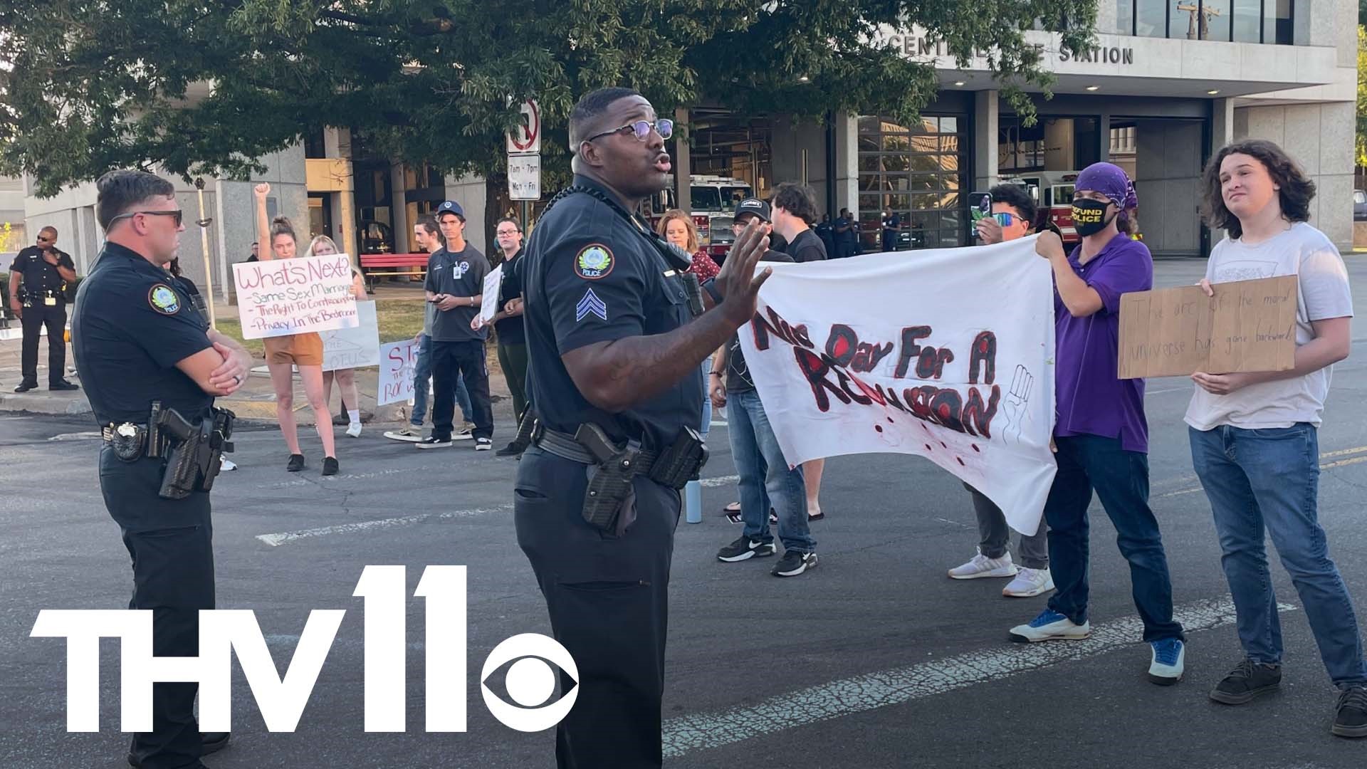 Little Rock protestors briefly shut down 7th and Chester Street on Wednesday as demonstrators gathered in response to the overturning of Roe v. Wade.