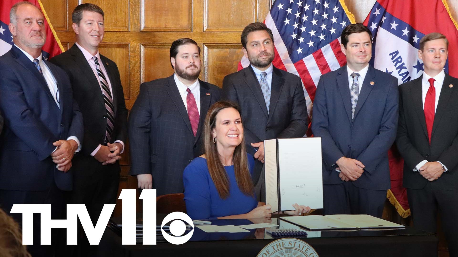 Gov. Sarah Sanders signed the measures after lawmakers wrapped up a special session focused on a fight to scale back the state's open-records laws.