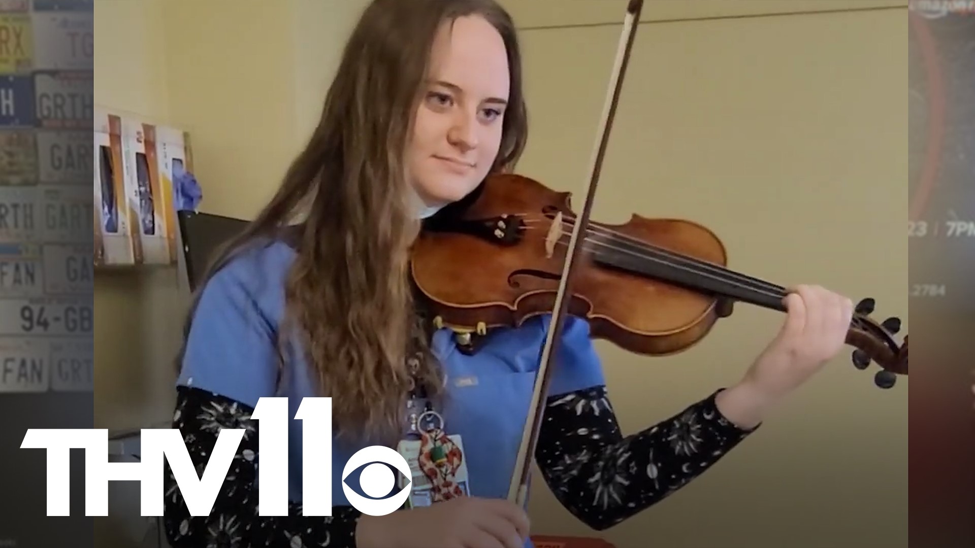 Annie McWilliams, nurse at CHI St. Vincent, was seen playing Amazing Grace on the violin for a patient in the hospital.