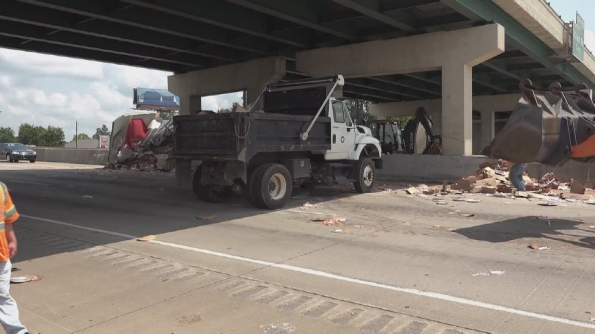 Tractor trailer accident leaves frozen pizzas spread across interstate