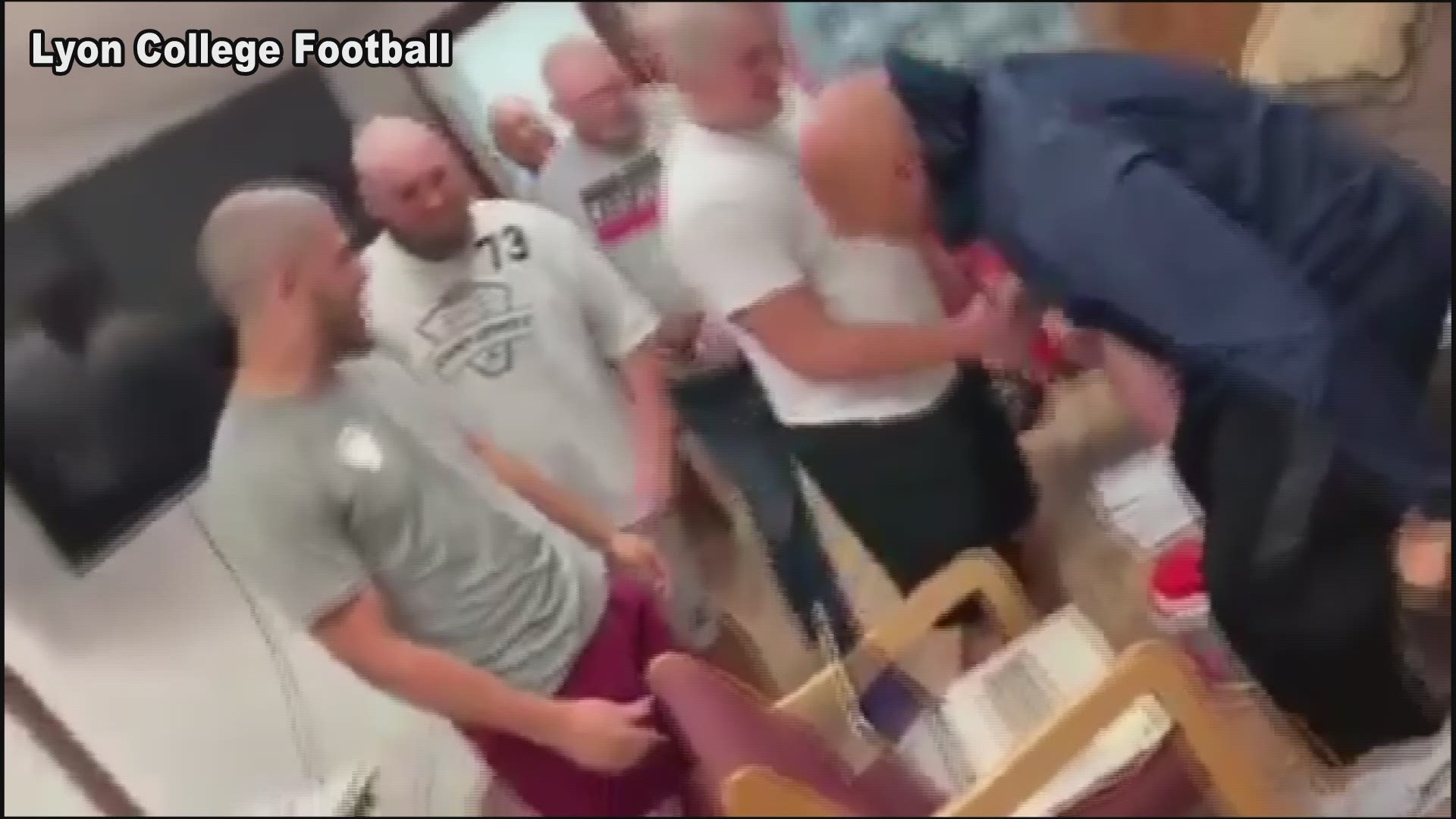 Football team shaves their heads in support of coach