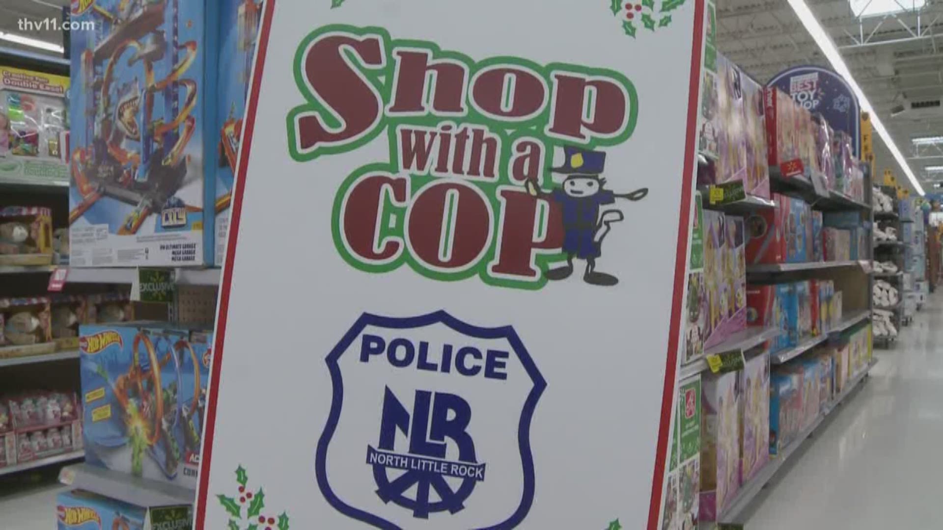 Along with their normal duties of fighting crime, North Little Rock police spent the morning making the Christmas season bright for dozens of kids.