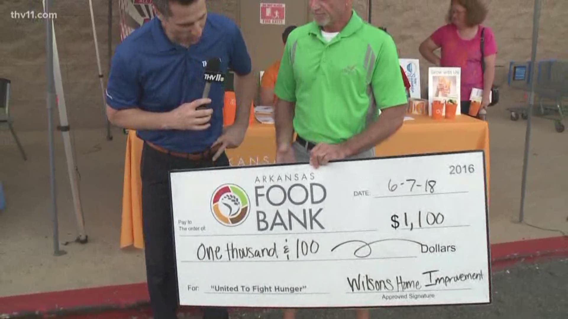 Paul Wilson with Wilson's Home Improvement donates in Hot Springs to the THV11 Summer Cereal Drive.