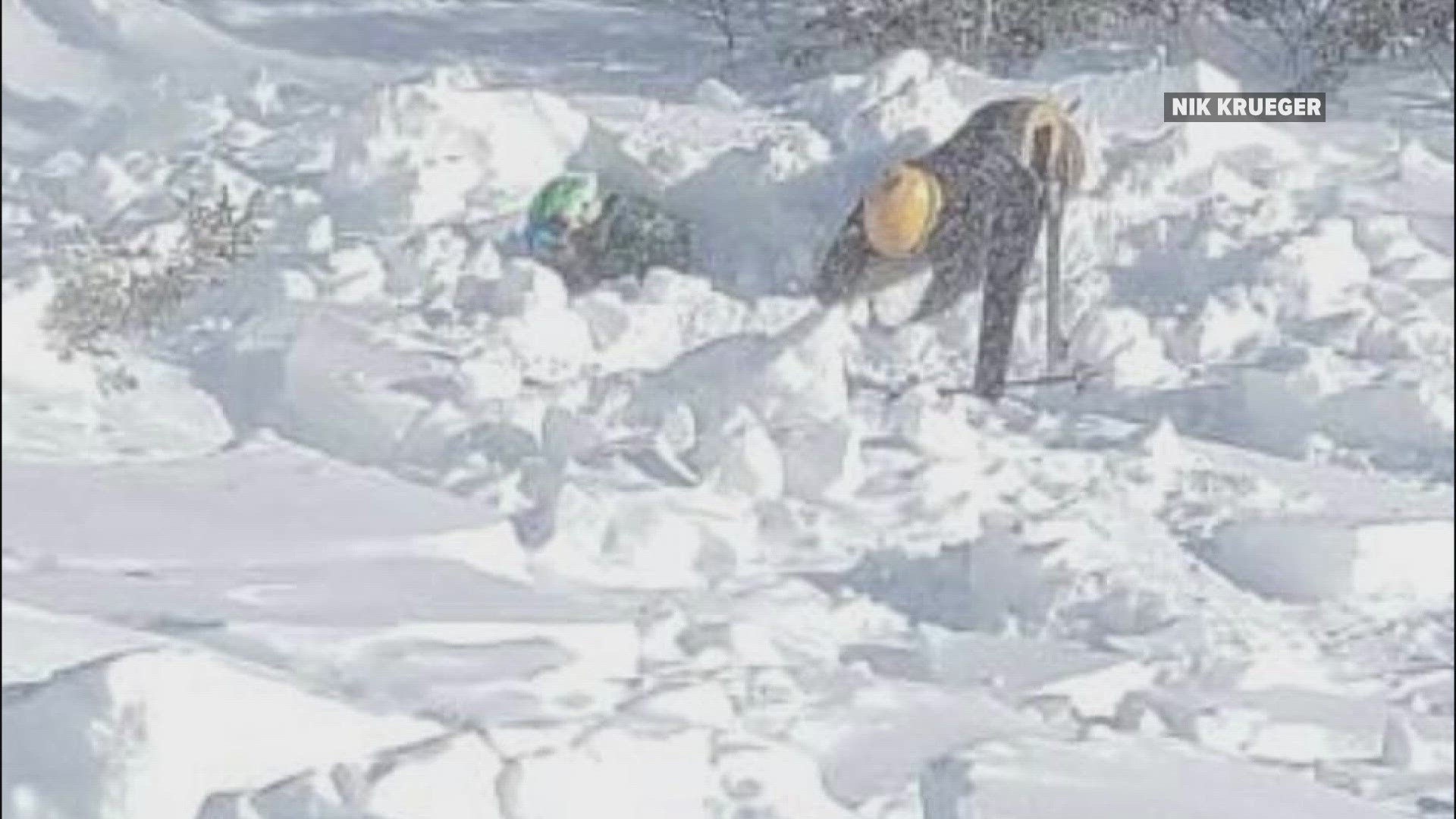 "I made my way down there and just started digging snow as fast as I could to get him out of there," a good Samaritan said.