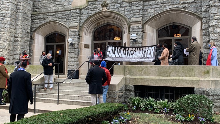 DC's oldest Black church hangs new Black Lives Matter banner after it was burned during MAGA protest
